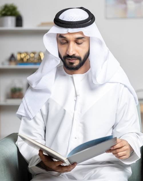 Arabic man holding book and reading