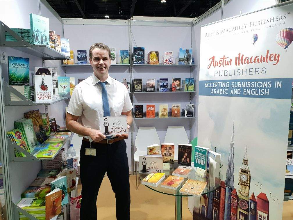 Author 'Liam Kelly' with his book 'Worried William' at Austin Macauley's stand during Abu Dhabi International Book Fair 2018.