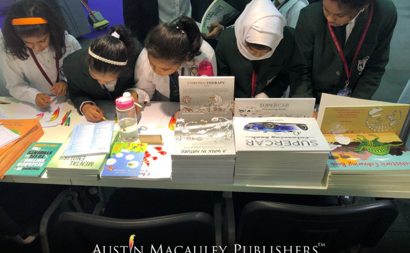 Children participating in coloring activity held by Austin Macauley at SCRF18